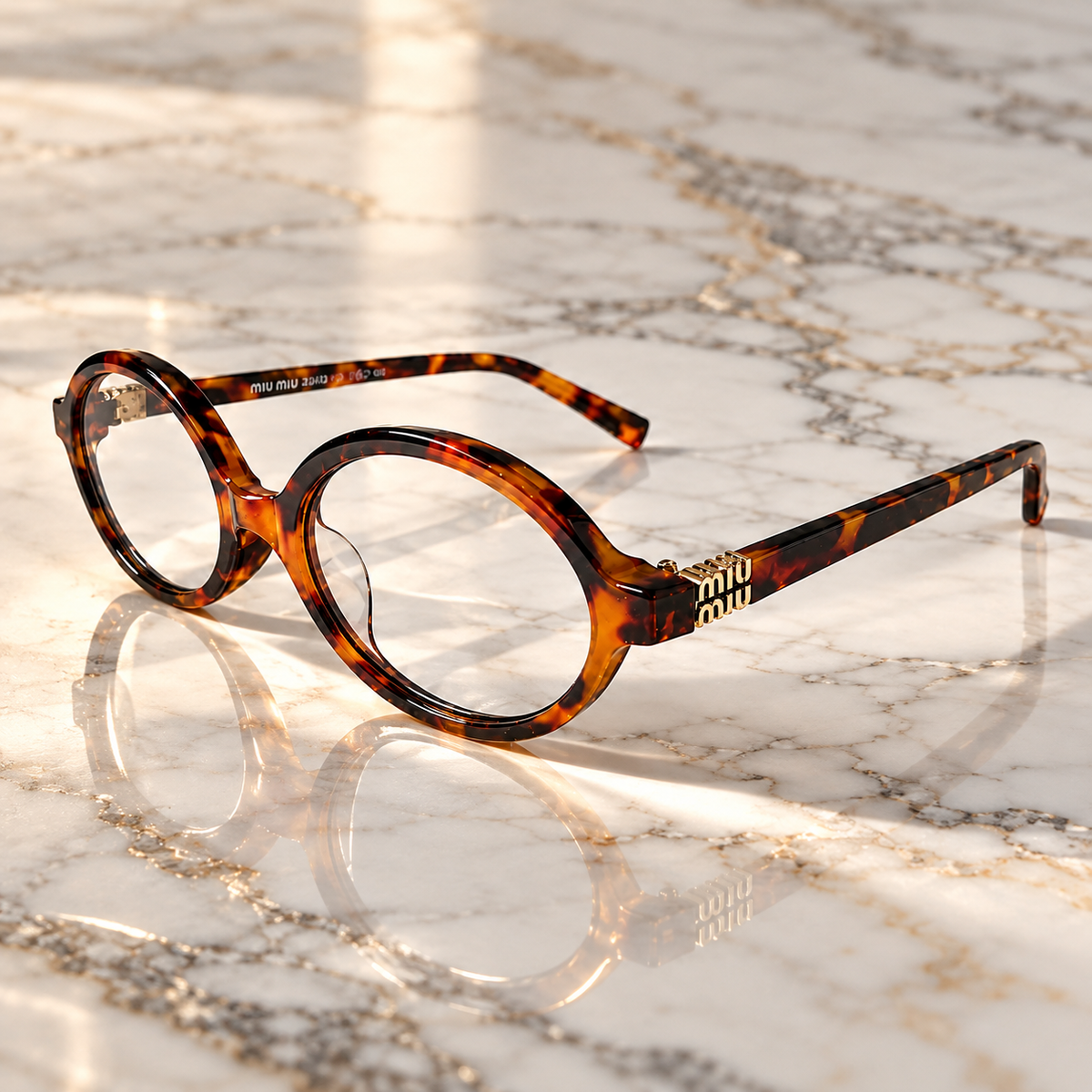 Miu Miu Tortoiseshell Oval Optical Eyeglasses with Gold Logo Detail