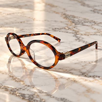 Miu Miu Tortoiseshell Oval Optical Eyeglasses with Gold Logo Detail